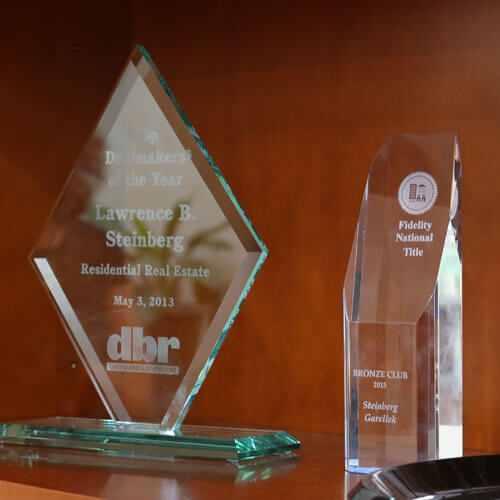 An image of awards bestowed upon law firm Steinberg Garellek of Boca Raton. 