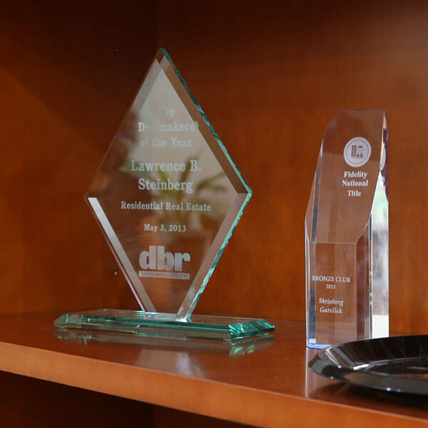 An image of business awards that links to the Business Law services provided at Steinberg Garellek. 